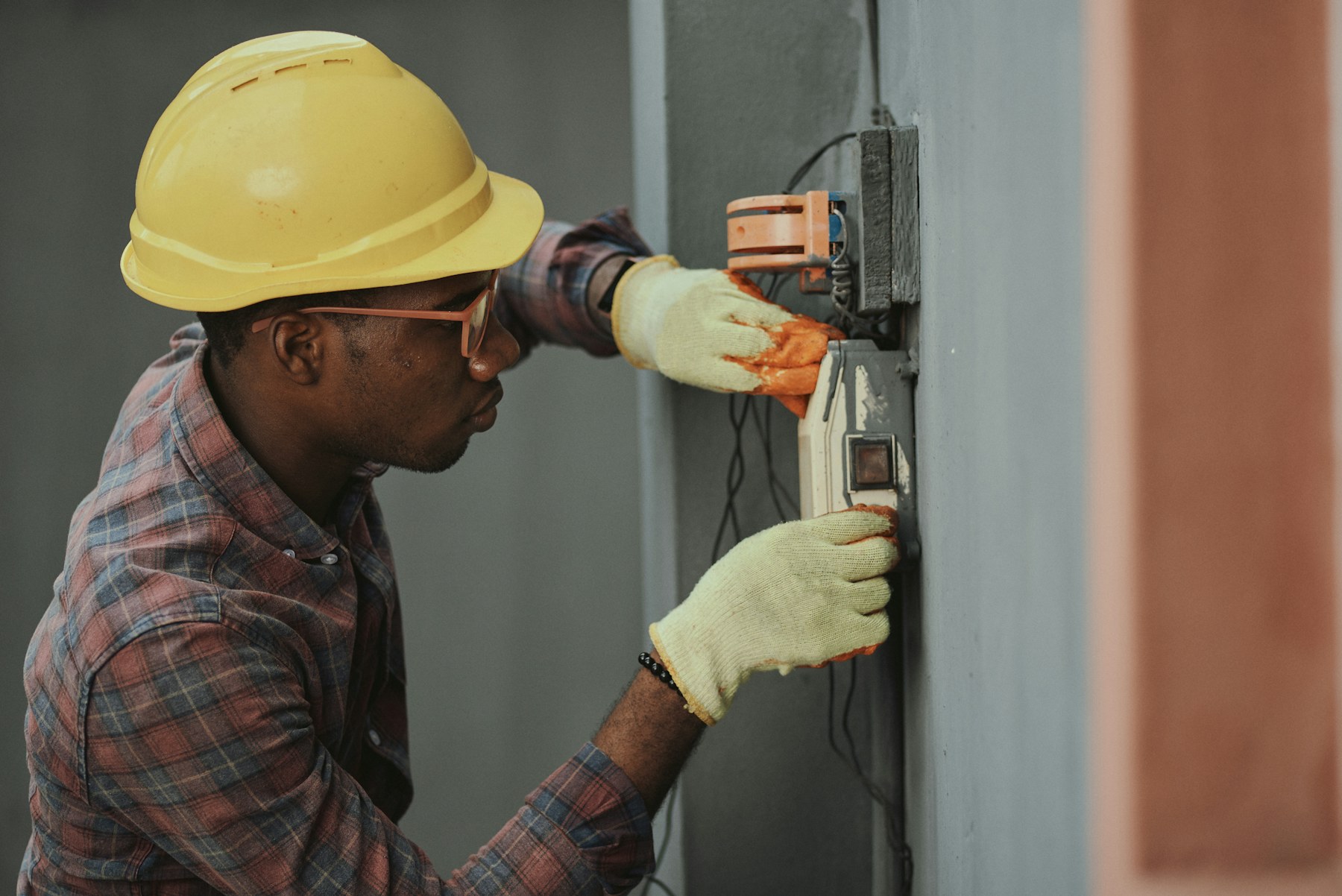 Electrician working on an electrical fitting