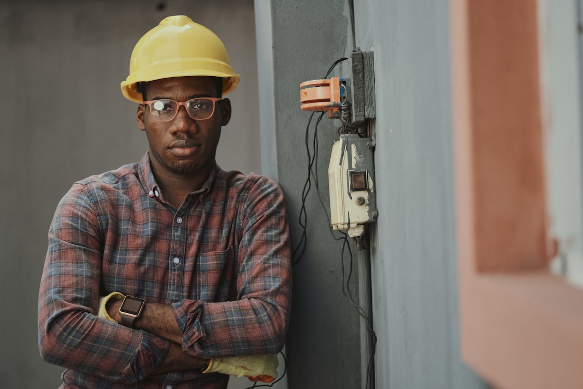 Electrician beside electrical wiring